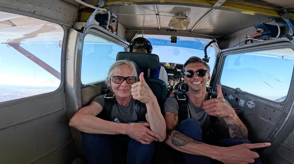 Laurel and Justin in a tiny airplane before skydiving